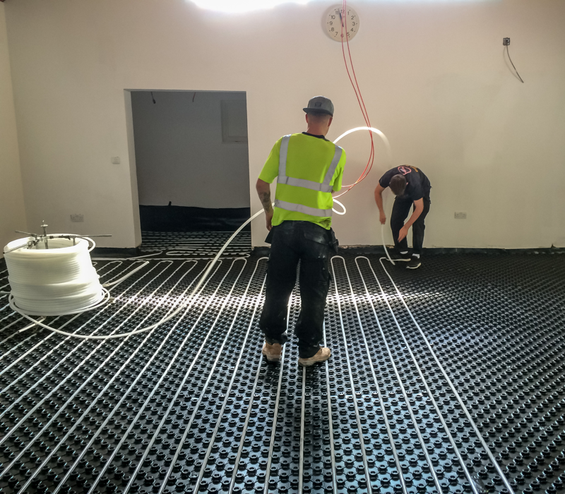 laying the underfloor heating ready for pouring screed